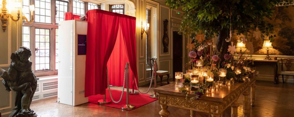 photo booth with red carpet at wedding reception