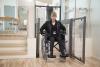 Lady in a wheelchair leaving the lift