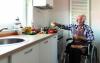 Man cooking - Unicook Airis Stove Guard Device on the wall